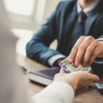 Debt Settlement for Borrowers with Multiple Loans
